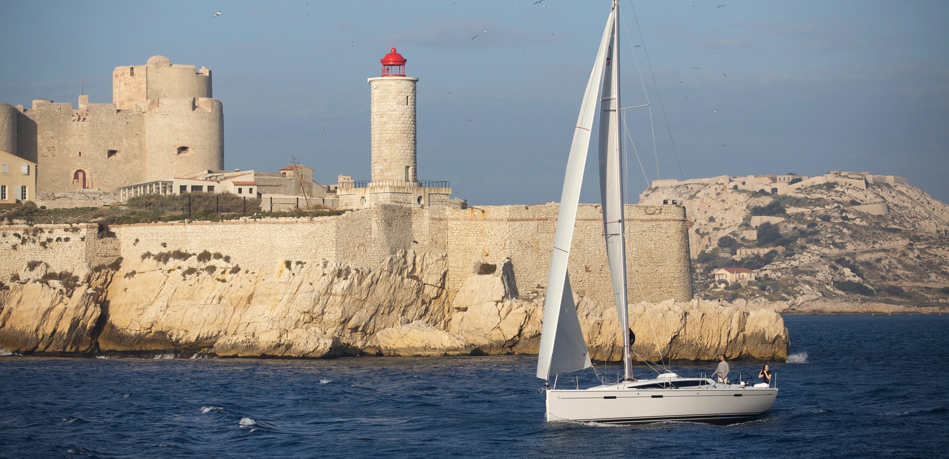 Elegant Dehler yacht sailing against a stunning backdrop, embodying quality and performance