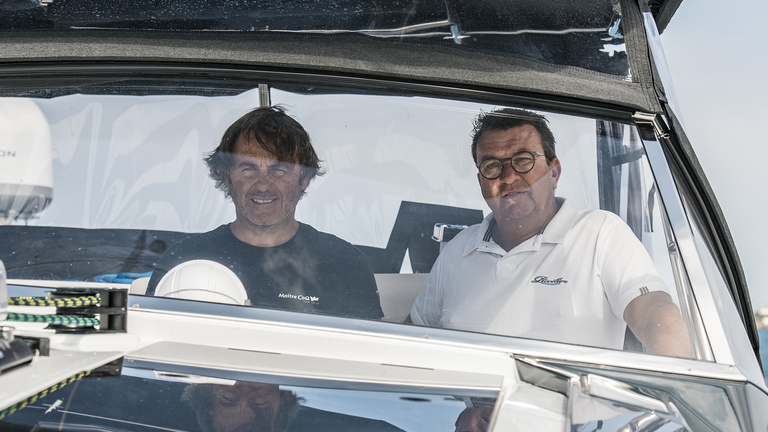 Yannick Bestaven and Gilles Wagner at the helm of green sailing catamaran