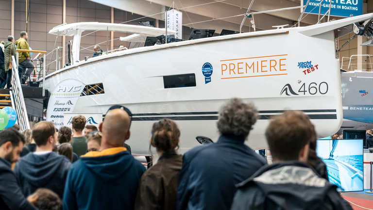 Crowd admiring the sleek and modern design of the Hanse 460 yacht model at Tulln Boat Show.