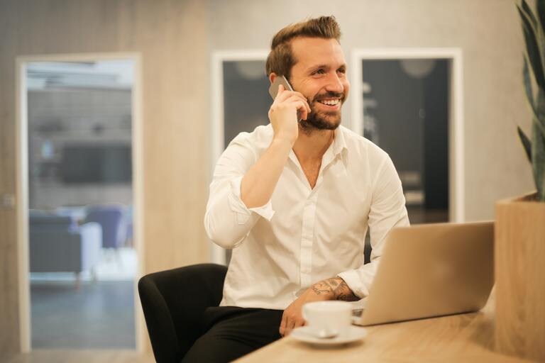 Finance manager takes call while working from home office