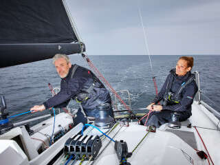 a man and a woman sailing