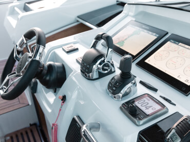 Fjord 48 open Exterior at anchor | dashboard, steering wheel, gas lever, Raymarine high end glass GPS chart plotter | Fjord