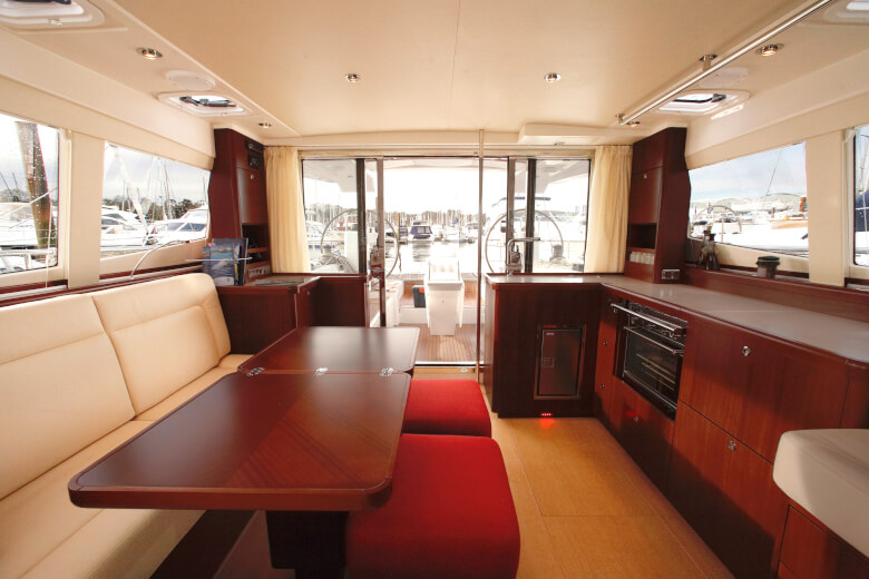 Table and seating area in the deck saloon of a Moody sailing yacht