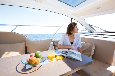 Sealine C330 saloon | Large windows and the bifold door provide abundant natural light - as well as wonderful views to the maritime scenery beyond. | Sealine