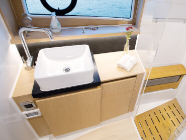 Sealine F430 bathroom | The Sealine F430 offers two bathrooms with showers below deck. | Sealine