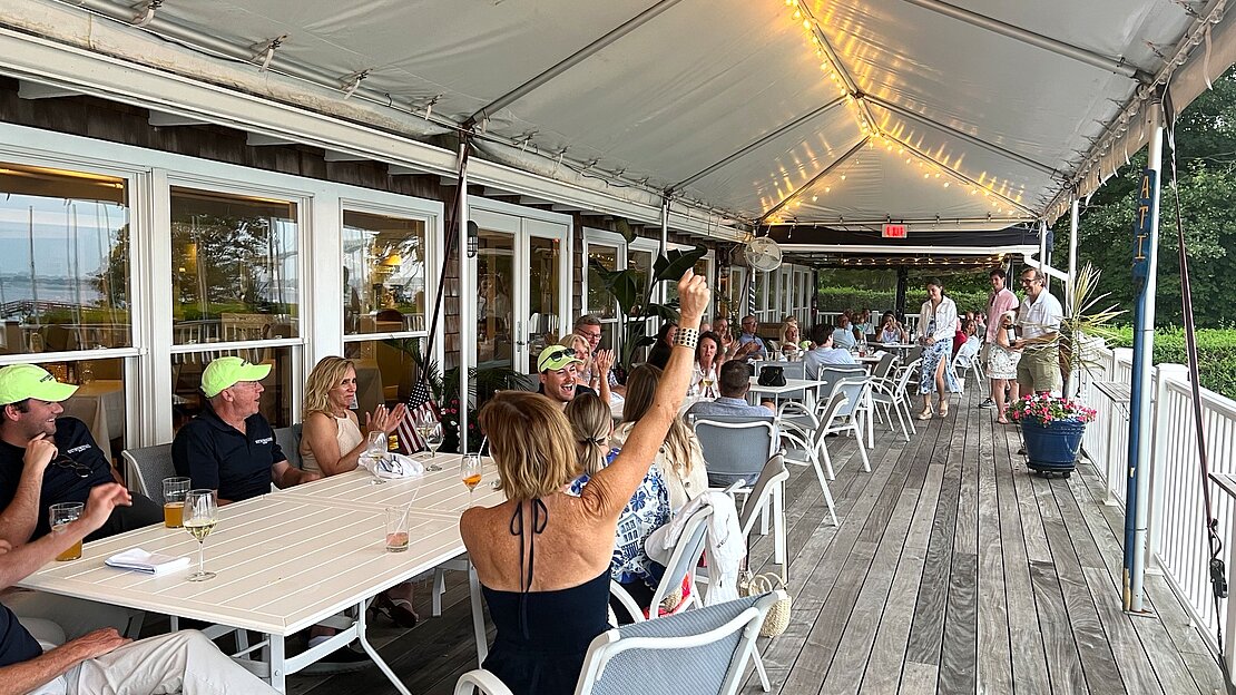 Yacht club cheers, celebrates victory and successful race